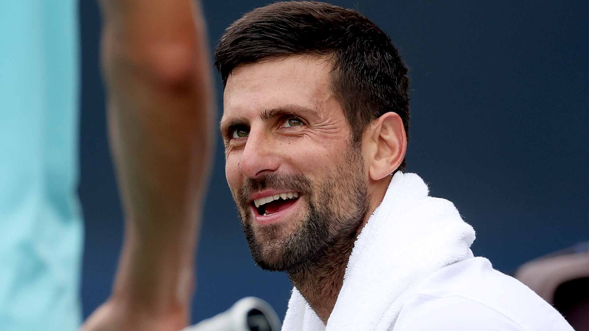 djokovic-us-open-2023-practice-smile-1693191589.jpg