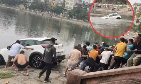 Xe SUV ‘đi lạc’ xuống hồ Định Công, hàng chục người phải hợp sức giải cứu